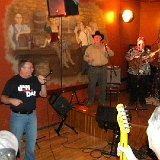 Ren introduces the High Caliber Band.  (Dan Falley was a former member of the original High Caliber Band)