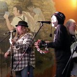 Geno Torres (in the hat) - vox and percussion